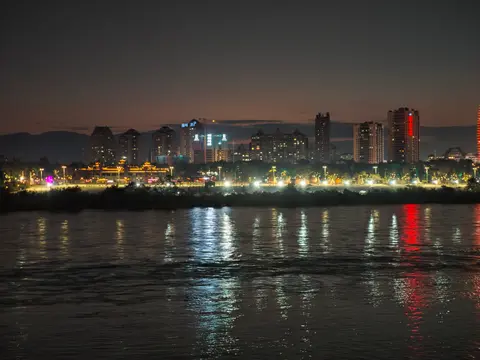 City lights of Jinghong reflected in the Lancang (Mekong) River at night