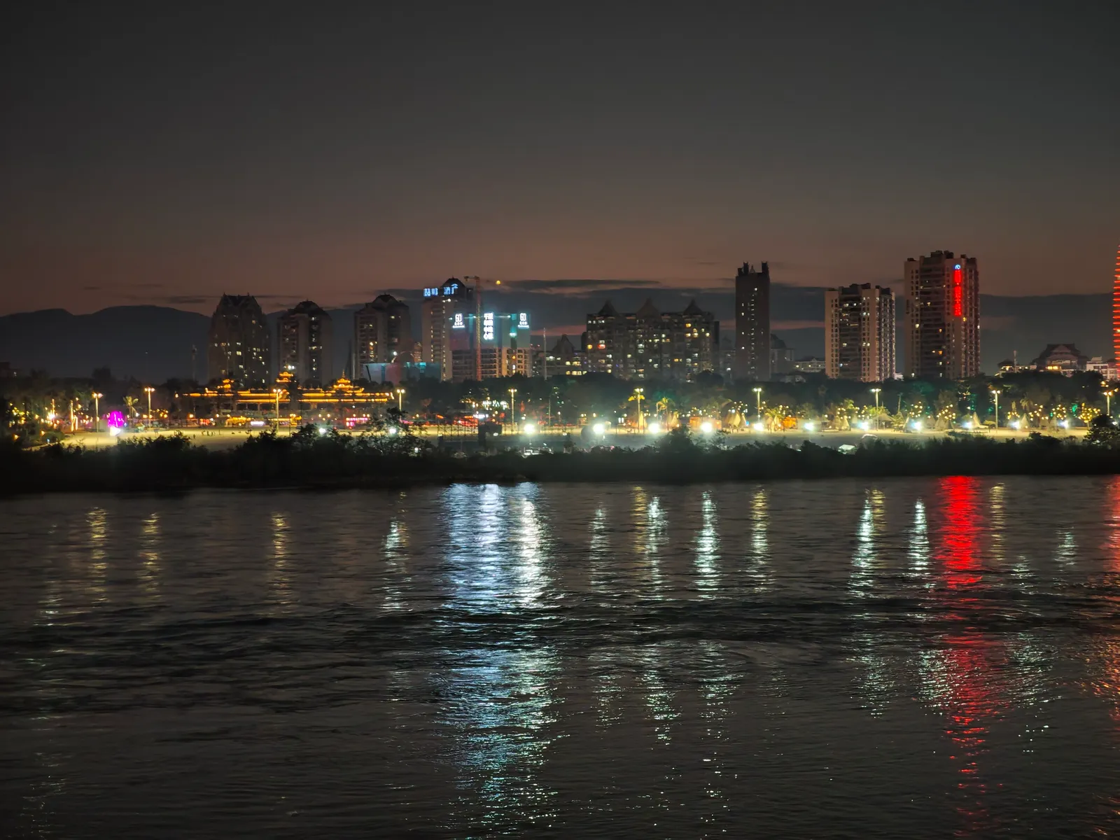 City lights of Jinghong reflected in the Lancang (Mekong) River at night