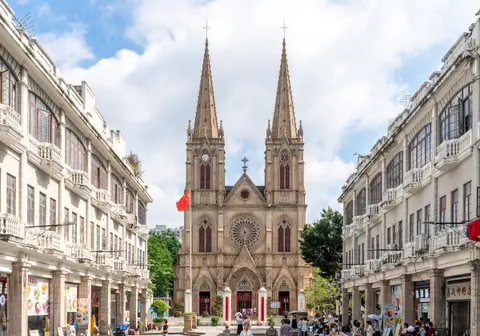 Twin granite spires of the Sacred Heart Cathedral seen down Yide Road