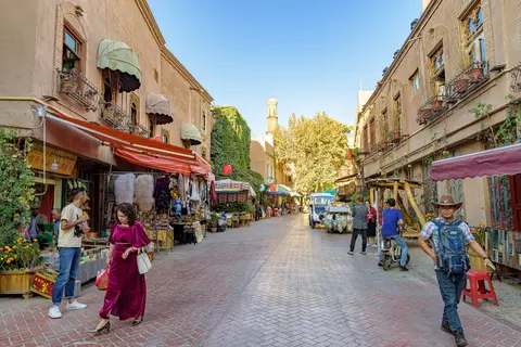 Brick lane with balconies and shops in Kashgar Old City