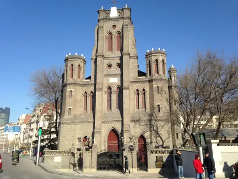 Grey-brick Gothic facade and towers of Wanghailou Church