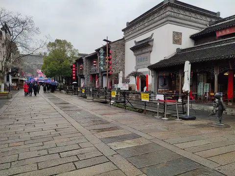 Stone-paved street lined with restored houses in Laomendong
