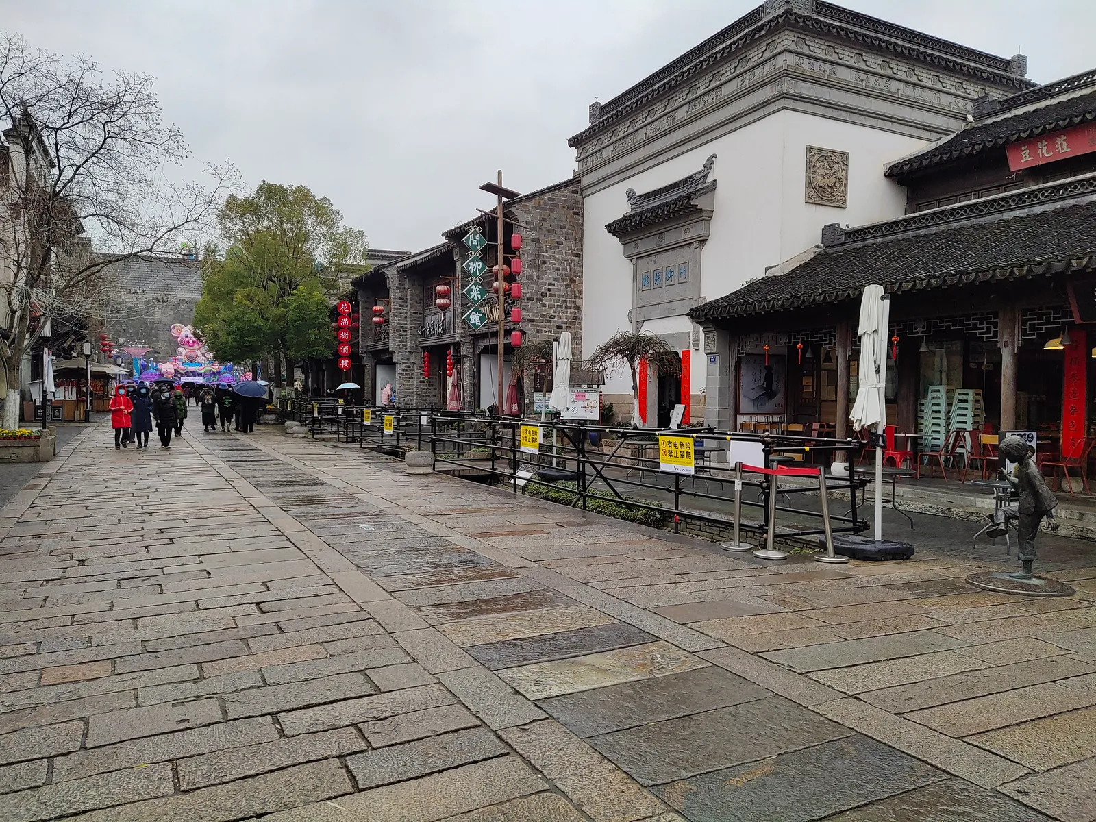 Stone-paved street lined with restored houses in Laomendong