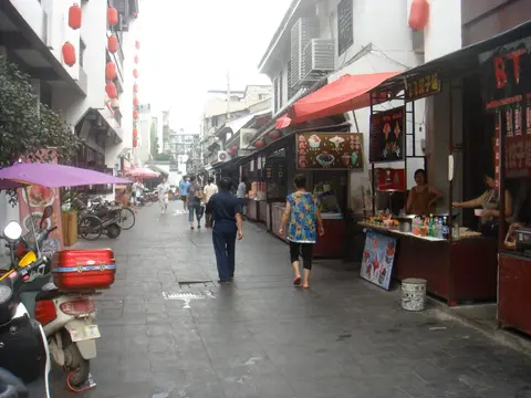 Snack stalls along the narrow lane of Hubu Alley