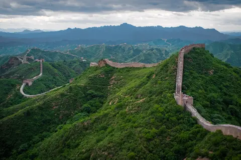 The Great Wall winding over green ridges at Jinshanling