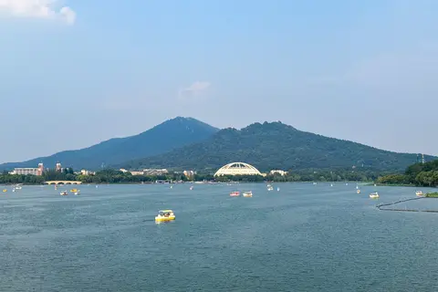 Xuanwu Lake with pleasure boats and Purple Mountain behind