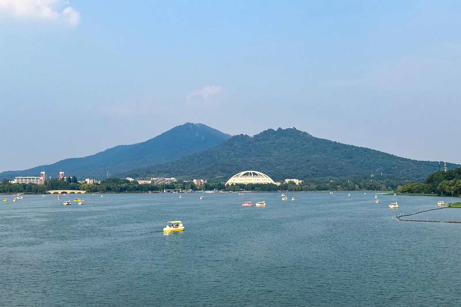 Xuanwu Lake with pleasure boats and Purple Mountain behind