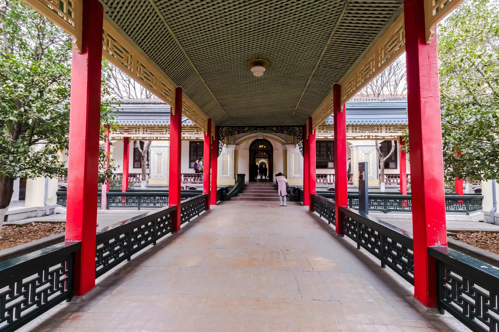 Red-pillared covered walkway leading to a hall in the Presidential Palace