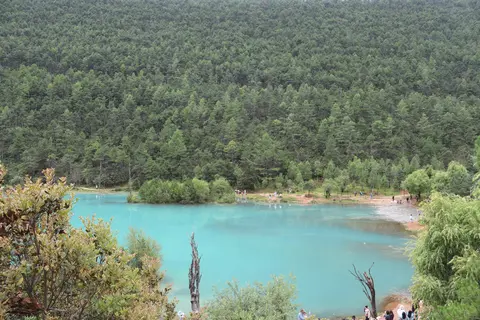 Turquoise lake of Blue Moon Valley surrounded by forest