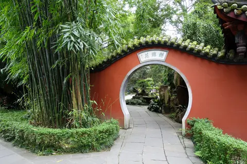 Red moon gate and bamboo in the gardens of Wuhou Shrine