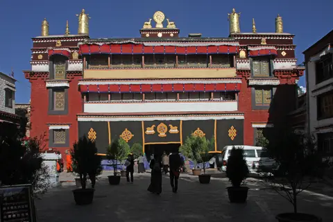 Gilded roof and red facade of Ramoche Temple in Lhasa
