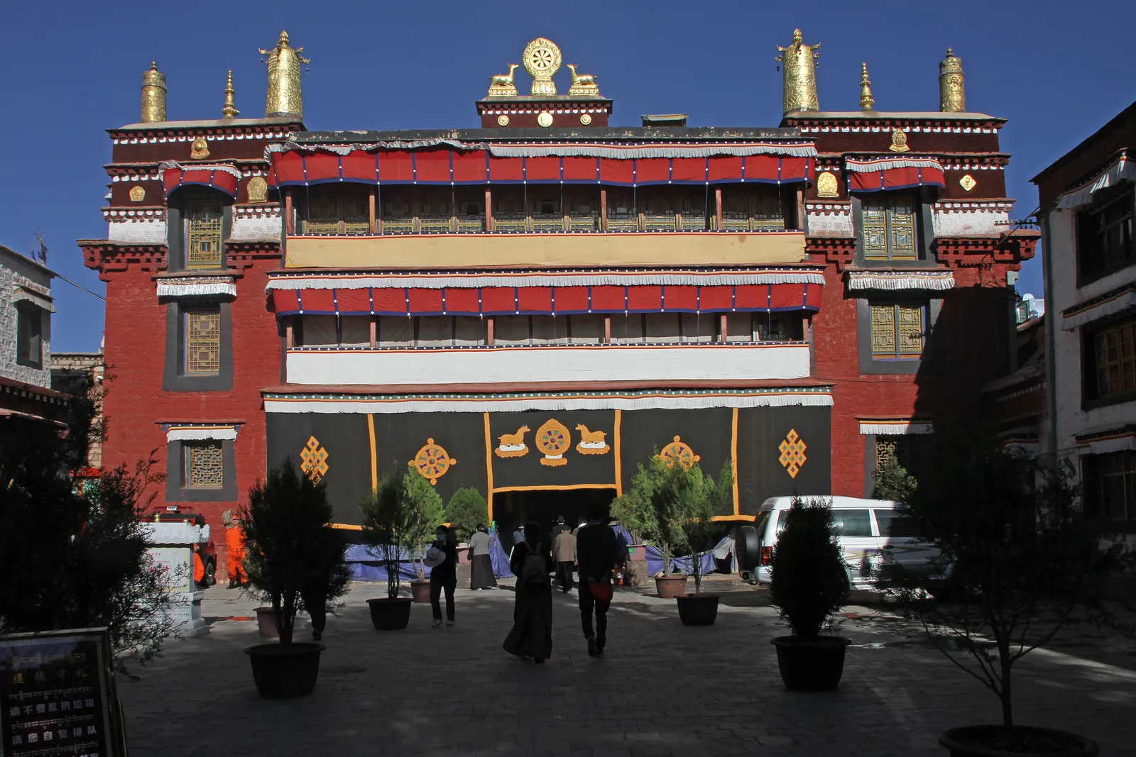 Gilded roof and red facade of Ramoche Temple in Lhasa