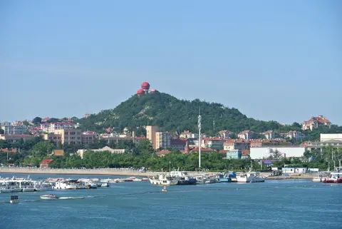 Signal Hill and its red mushroom-domed towers seen from the sea
