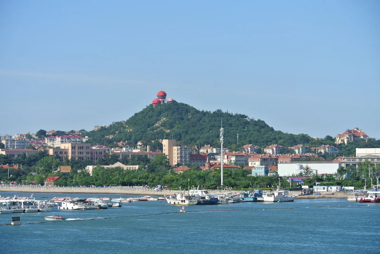 Signal Hill and its red mushroom-domed towers seen from the sea
