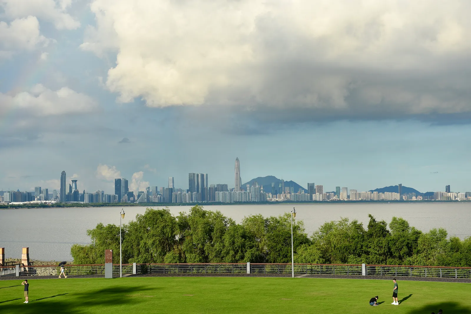 Lawn and waterfront of Shenzhen Bay Park looking across the bay