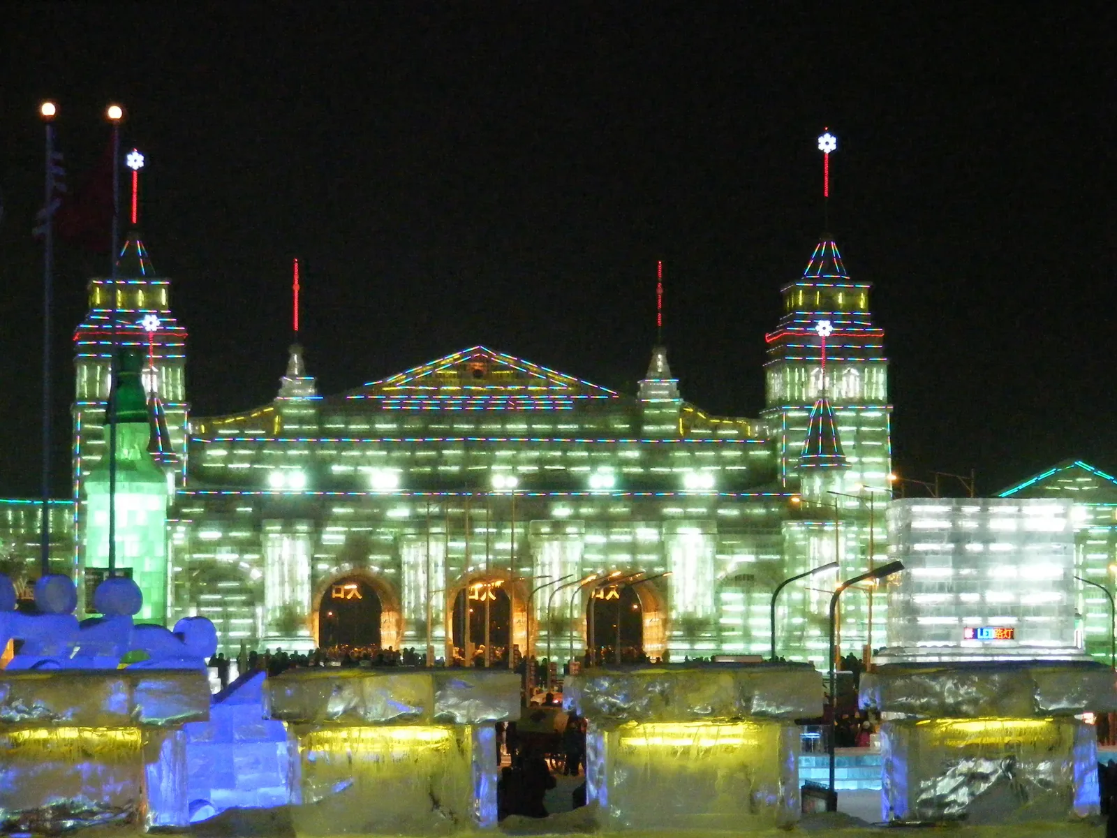 Illuminated ice palace at Harbin Ice and Snow World at night
