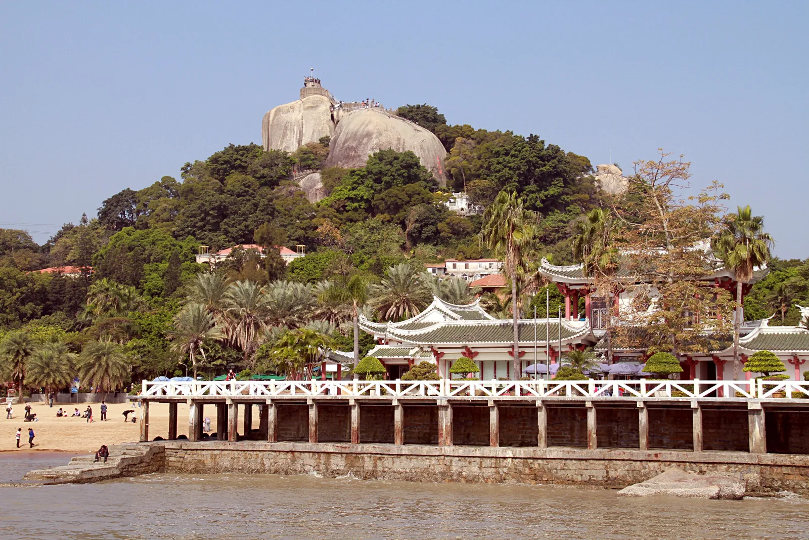 Sunlight Rock rising above the trees and seafront of Gulangyu