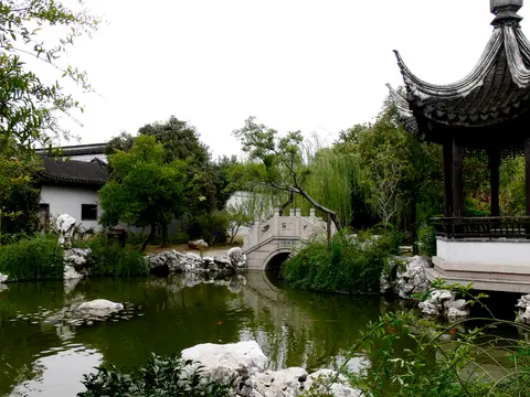 Pond, pavilion and arched bridge in the Yan Family Garden, Mudu
