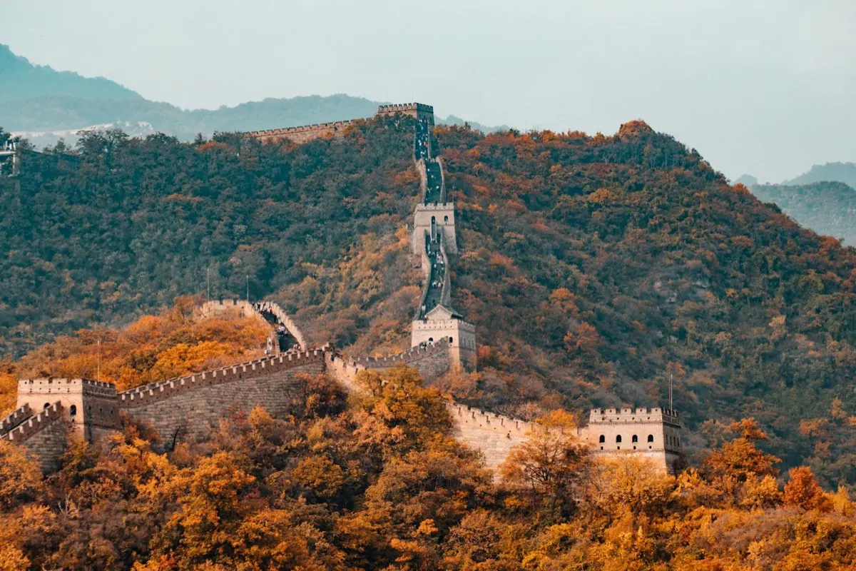 The Great Wall winding over autumn hills
