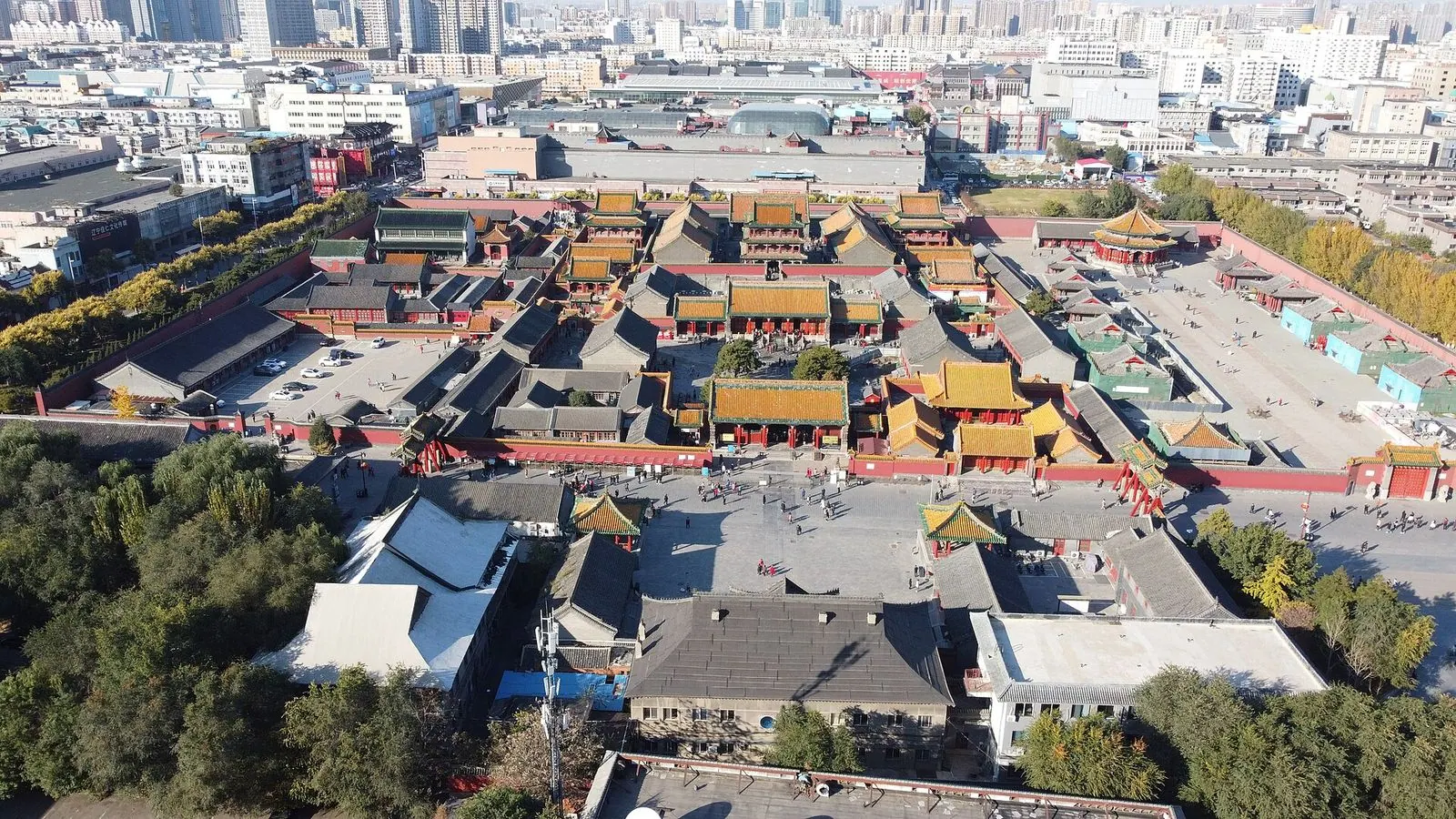 Aerial view of the Shenyang Imperial Palace with the city skyline behind