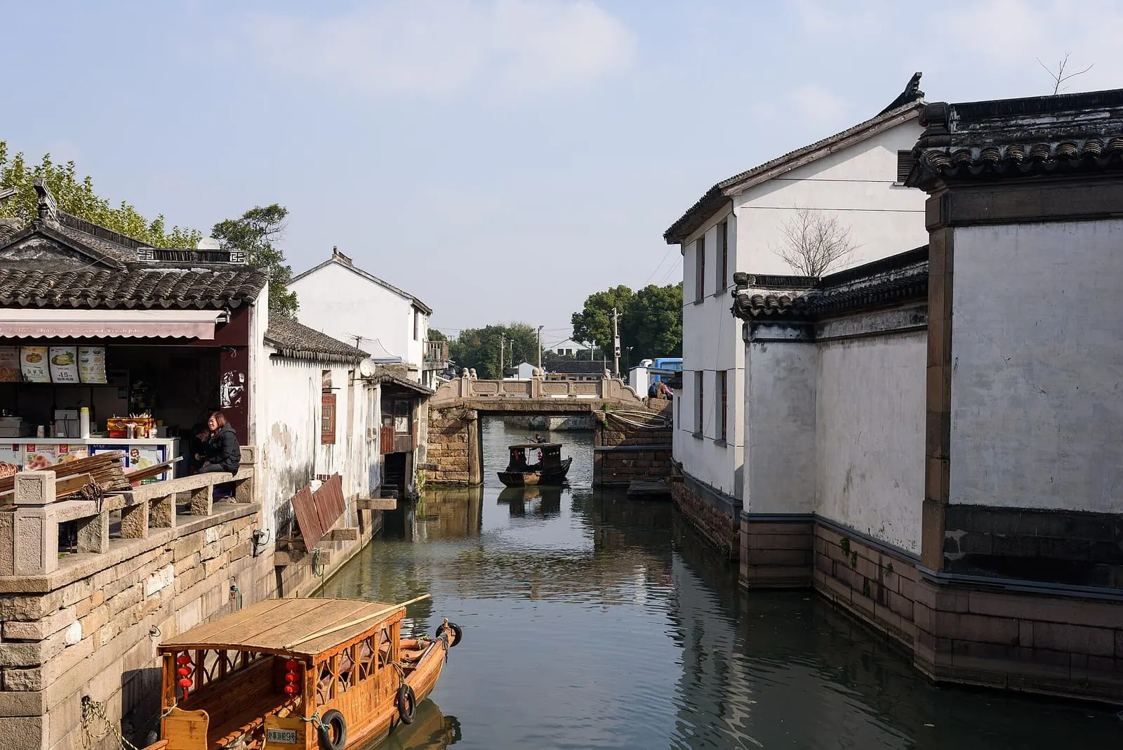Canal, stone bridge and whitewashed houses in old Suzhou