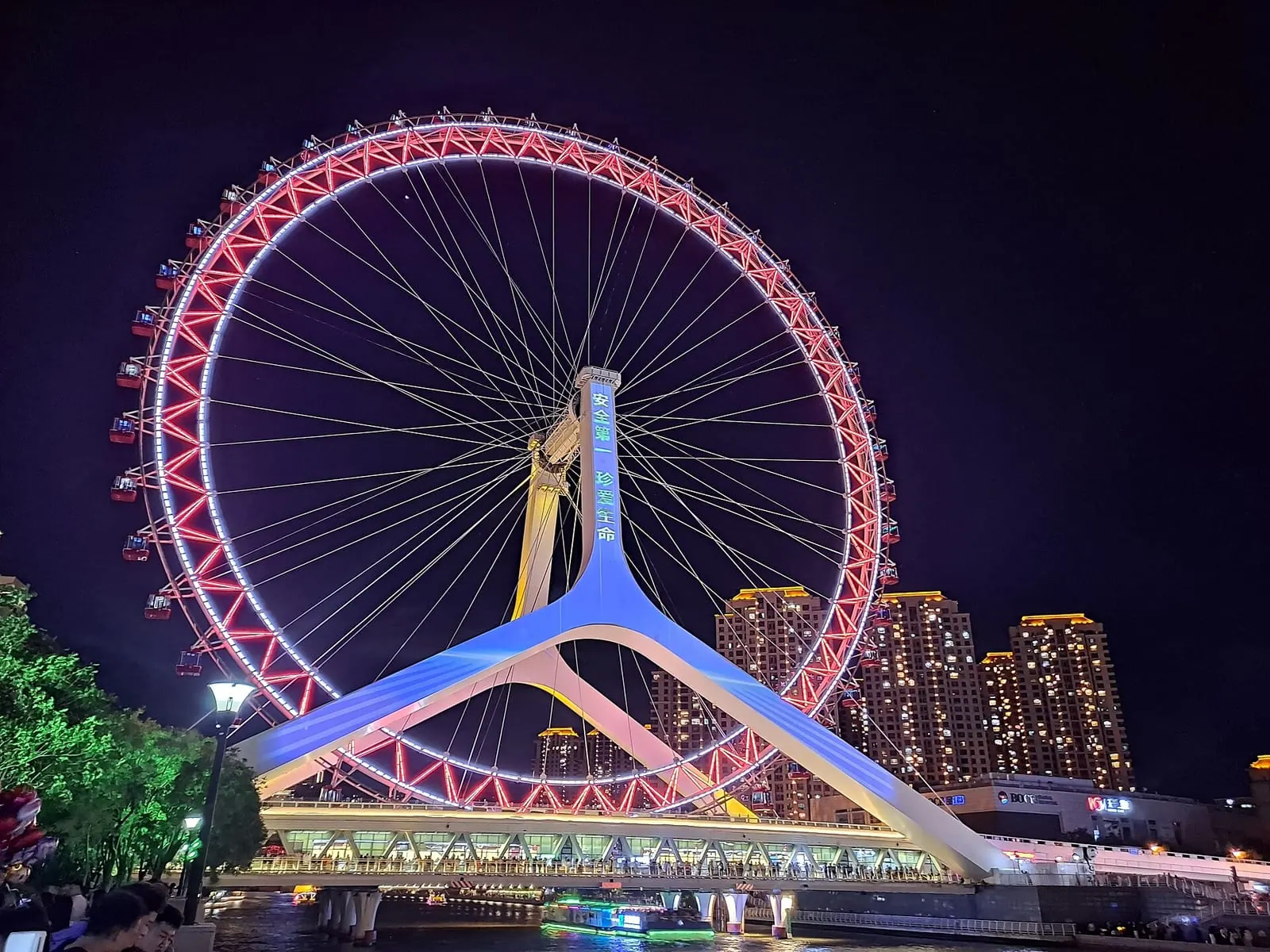 Tianjin Eye Ferris wheel over the Haihe River at night
