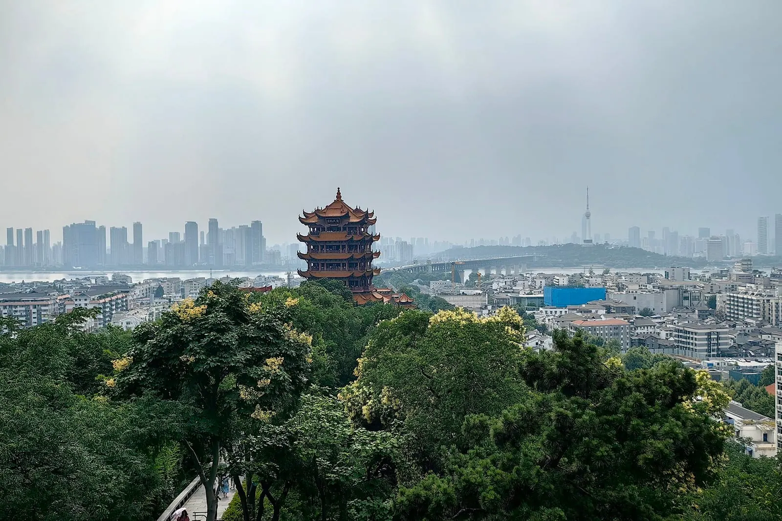 Yellow Crane Tower above the trees with the Wuhan skyline